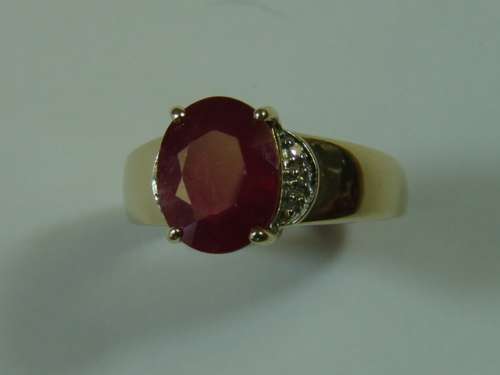 9ct Yellow gold,  African ruby and diamond Ring. Total weight 4 grams.