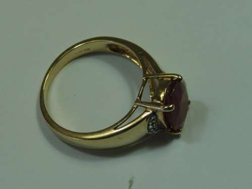 9ct Yellow gold,  African ruby and diamond Ring. Total weight 4 grams.