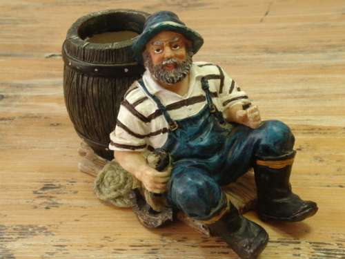 Fisherman with barrel figurine, vintage