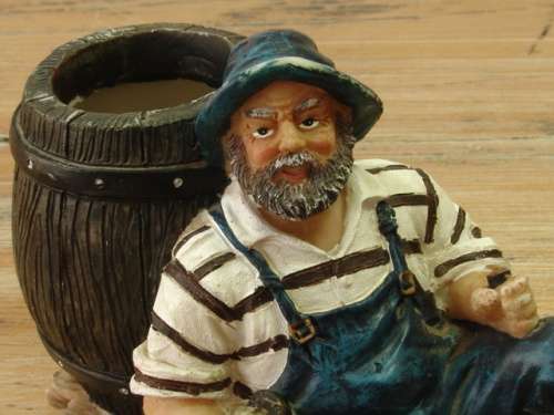 Fisherman with barrel figurine, vintage