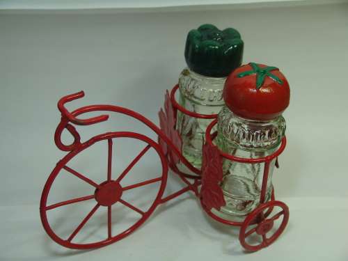 Spice shakers on a Bicycle stand, vintage
