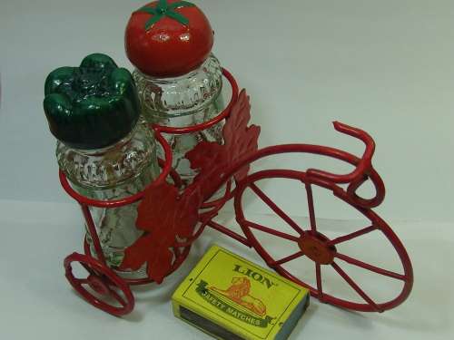 Spice shakers on a Bicycle stand, vintage
