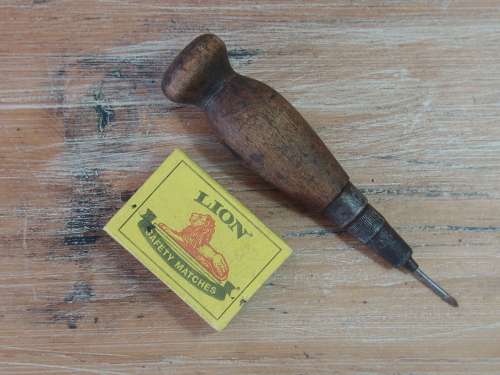 Vintage leather punching tool with wooden handle. Sharp point.