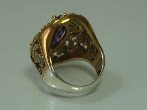 Excuisite 925 Silver and Gilded silver dress Ring, set with Amethysts and clear stones, 12.4g