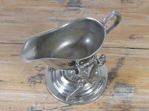Silver plated Victorian tilting gravy boat with warming stand