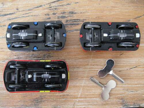 Boxed set of 3 vintage wind up tin Cars, Fire car, Taxi and Police car with winding keys mint in box