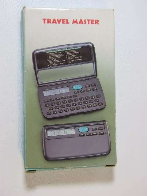 Vintage Travel Master, world time, calender, clock, conversions, alarm, etc., mint and working