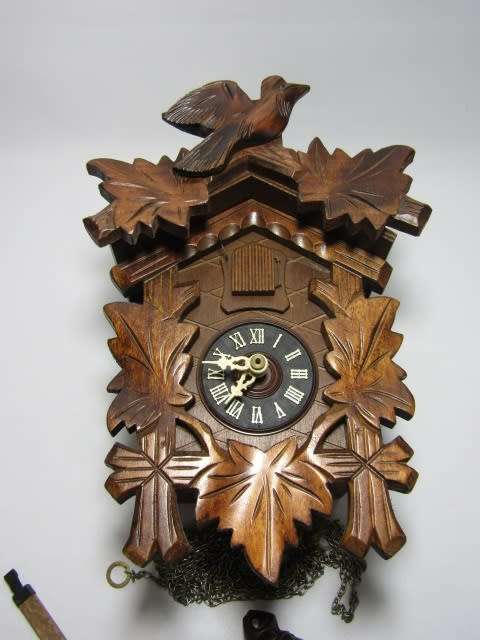 German mechanical Black Forest Cuckoo Clock with pendulum and weights and in excellent working cond.