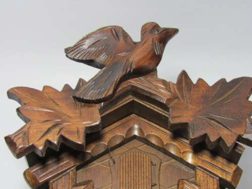 German mechanical Black Forest Cuckoo Clock with pendulum and weights and in excellent working cond.