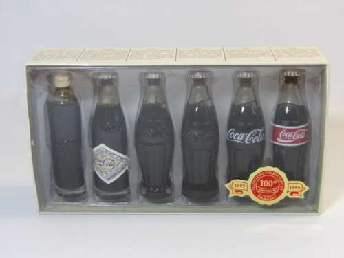 1999 Boxed set of 6 Coca Cola miniature glass Bottles.Evolution of the contour bottle 1899-1999 mint