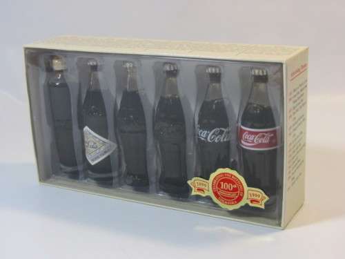 1999 Boxed set of 6 Coca Cola miniature glass Bottles.Evolution of the contour bottle 1899-1999 mint