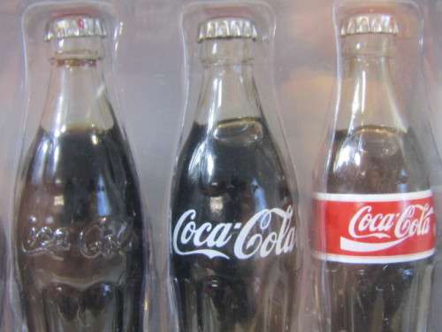 1999 Boxed set of 6 Coca Cola miniature glass Bottles.Evolution of the contour bottle 1899-1999 mint