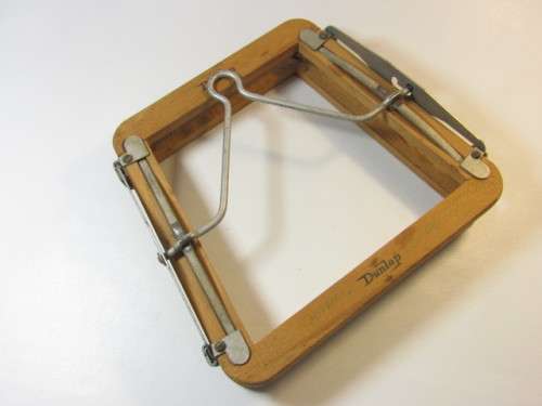 Vintage Champion Tennis Racket with a Dunlop Stretcher in excellent condition