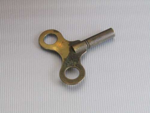 Edwardian mahogany Mantle Clock with decorative wooden inserts and brass fittings, with Key, 21cm