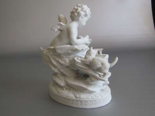 Vintage lot of 2 Porcelain Figurines; Angel with Bird and Cat, 13cm, Cherub holding flowers, 14cm
