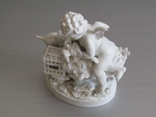 Vintage lot of 2 Porcelain Figurines; Angel with Bird and Cat, 13cm, Cherub holding flowers, 14cm