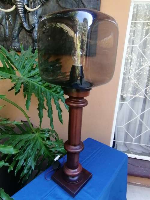 Wooden lamp with molded plastic shade