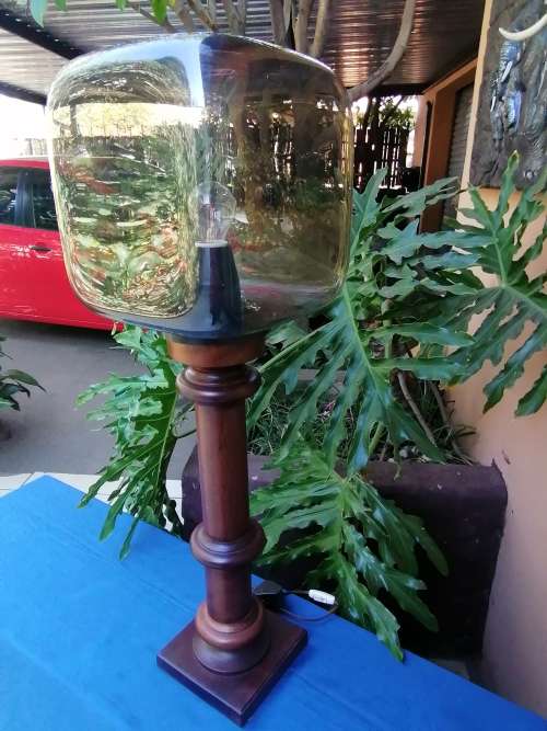 Wooden lamp with molded plastic shade