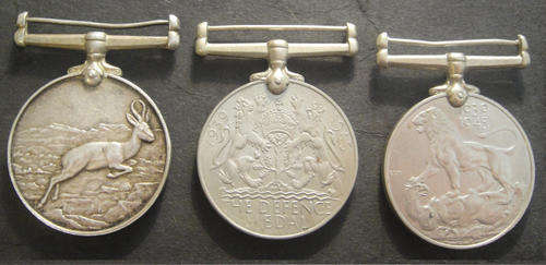 Three World War Two Medals with name removed