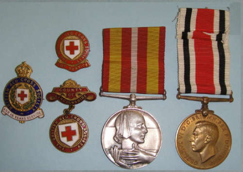 Medals and Pin badges to George and Alice Finn