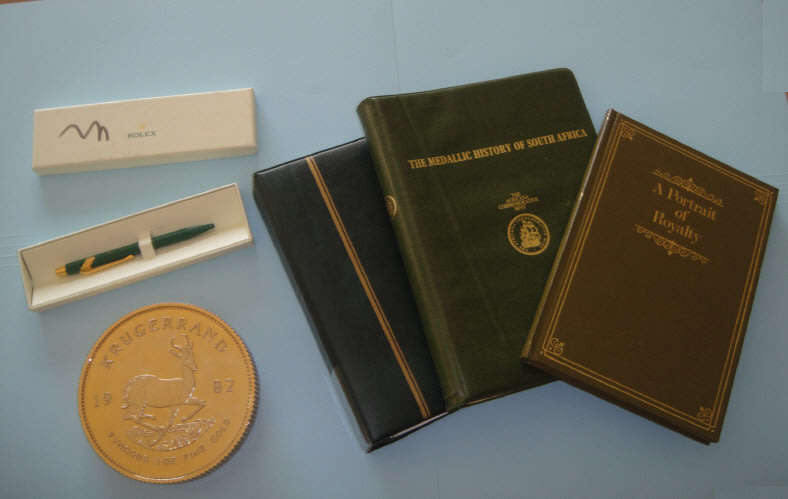 Krugerrand Paper Weight, Rolex Pen, Numismatic Books and Coin Album