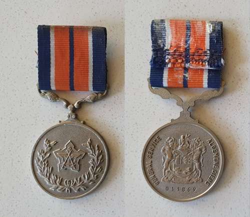 Two SADF medals with name tag as per photo.