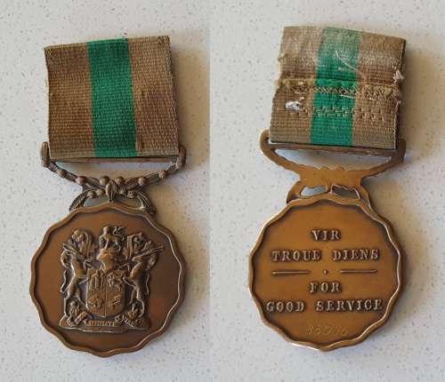 Two SADF medals with name tag as per photo.