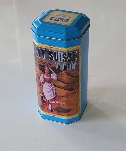 NESTLE tin as per photos