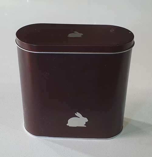 Brown tin with image of a rabbit as per photos