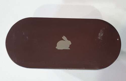 Brown tin with image of a rabbit as per photos