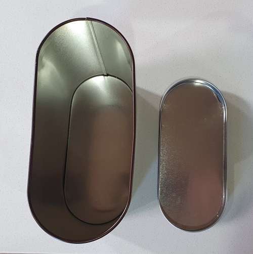 Brown tin with image of a rabbit as per photos