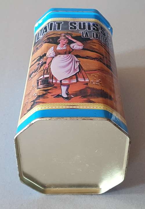 NESTLE tin as per photos