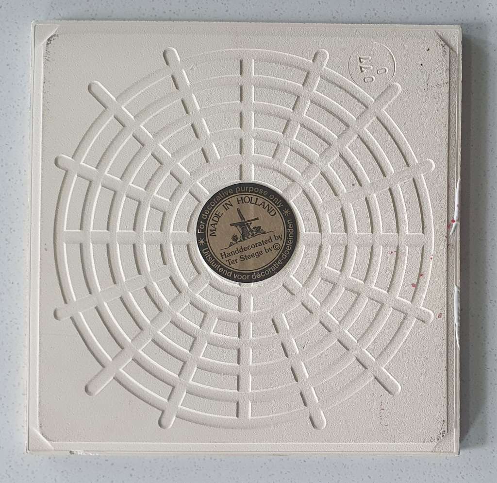 Hand decorated tile - made in Holland as per photo.