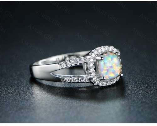 Exquizite Queen ring with simulated Fire Opal and white gold polish