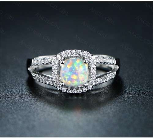 Exquizite Queen ring with simulated Fire Opal and white gold polish