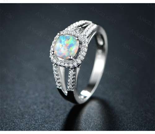 Exquizite Queen ring with simulated Fire Opal and white gold polish