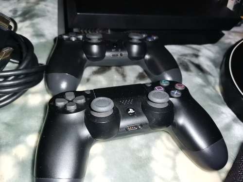 Sony PS4 1TB (SSHD) + 2 Controllers (One is a Double Shock 4 and one is original) + 14 Games+2M HDMI