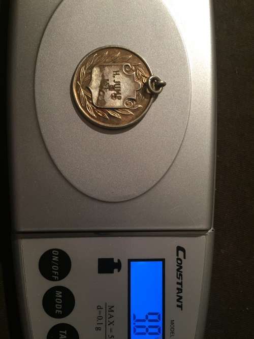 Medallion hallmarked as "Silver"