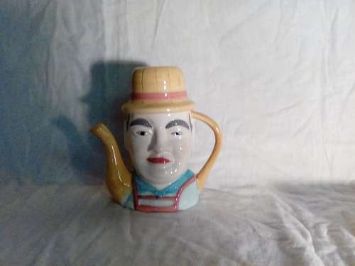THIS IS A UNIQUE CERAMIC TEA POT IN EXCELLENT CONDITION - REAL NICE AND RARE PIECE!!