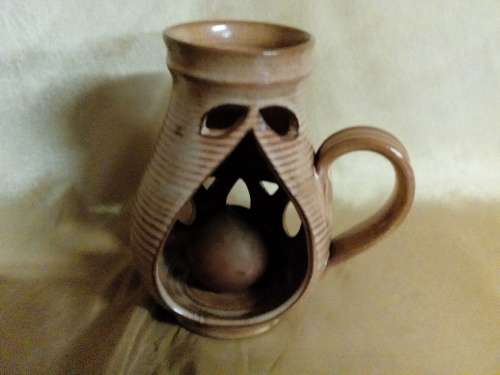 I HAVE A REAL NICE POTTERY CANDLE HOLDER - SUCH A BEAUTIFUL PIECE!!!!