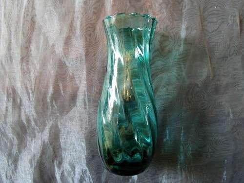 I HAVE SUCH A STUNNING GREEN GLASS VASE - REAL NICE PIECE!!!!
