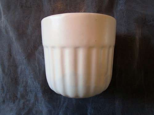 I HAVE A BEAUTIFUL CREAM CERAMIC PLANT POT - REAL NICE PIECE!!!!