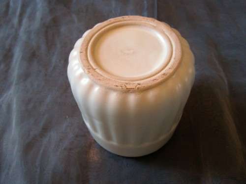 I HAVE A BEAUTIFUL CREAM CERAMIC PLANT POT - REAL NICE PIECE!!!!