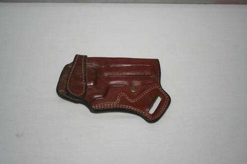 VINTAGE LEATHER FIRE ARM HOLSTER..