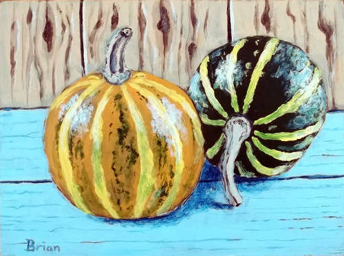 Two pumpkins on a shelf