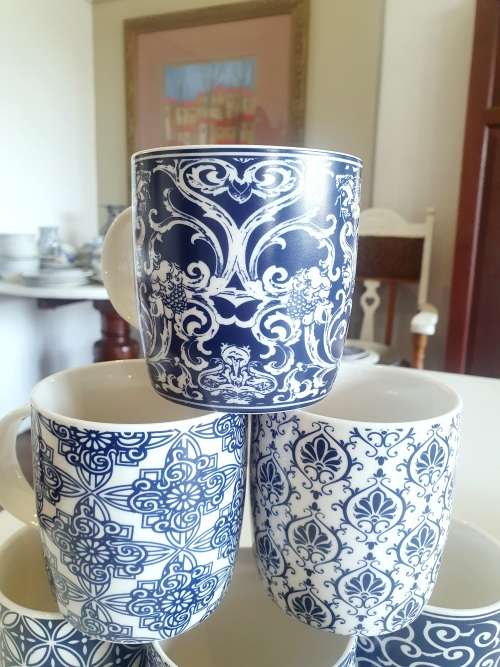 Set of six blue and white mugs