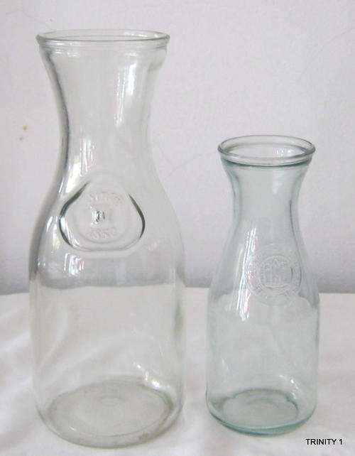 2 GLASS BOTTLES(+-24cm long and +-18cm long)
