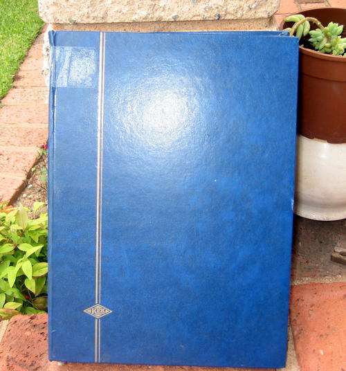 Blue KEK Album with black pages. 14 pages, 28 sides and 9 strips per side. Used.