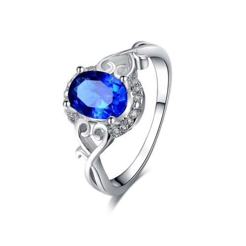 White Gold Filled Ring With 16 Simulated Diamonds And Blue Sapphire