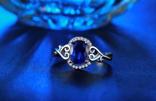 White Gold Filled Ring With 16 Simulated Diamonds And Blue Sapphire